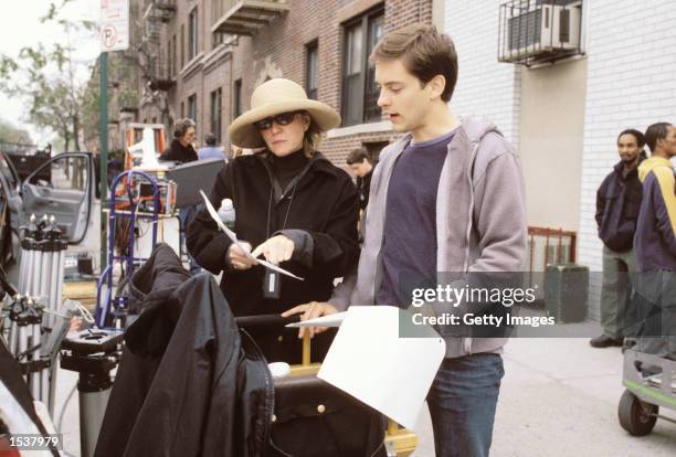 Actor Tobey Maguire and producer Laura Ziskin work on the set of the movie "Spider-Man".