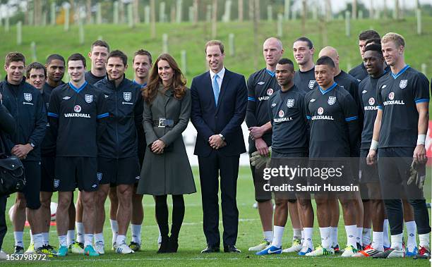 Prince William, Duke of Cambridge and Catherine, Duchess of Cambridge pose with the England team during the official launch of The Football...