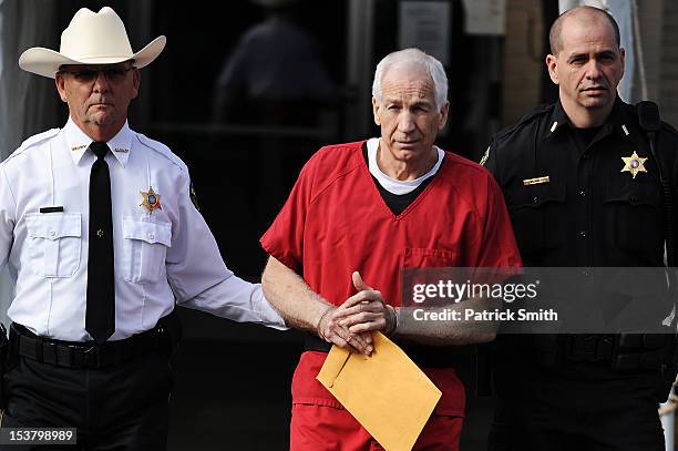Former Penn State assistant football coach Jerry Sandusky leaves the Centre County Courthouse after being sentenced in his child sex abuse case on...