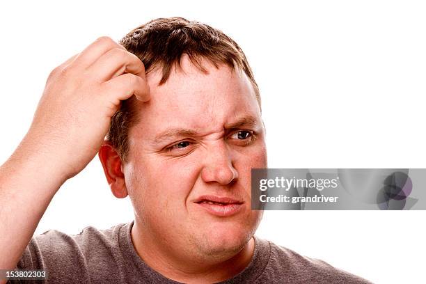 man scratching his head - zich op het hoofd krabben stockfoto's en -beelden