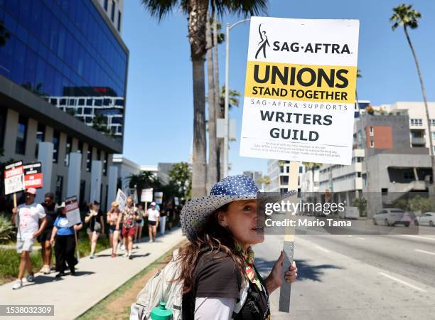 Member Christine Robert pickets in solidarity with striking WGA workers outside Netflix offices on July 12, 2023 in Los Angeles, California. Members...