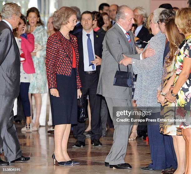 King Juan Carlos kisses his sister Princess Pilar of Spain while Queen Sofia of Spain watches during Museum Thyssen Bornemisza 20th anniversary event...