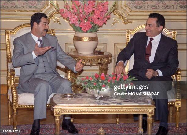 Iraqi President Saddam Hussein gestures 28 January 1990 in Cairo as he meets with Egyptian President Hosni Mubarak during in an unannounced visit to...