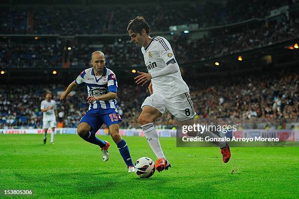 Kaka of Real Madrid CF competes for the ball with Laure Sanabria of RC Deportivo La Coruna during the La Liga match between Real Madrid CF and RC...