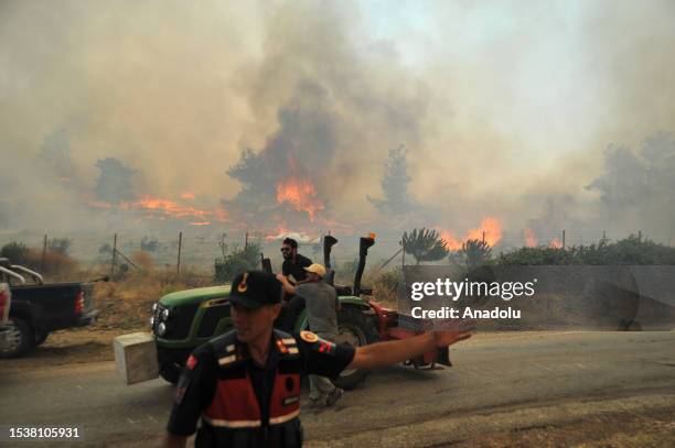 Smoke rises after a fire broke out in the woodland of Canakkale, Turkiye on July 17, 2023.