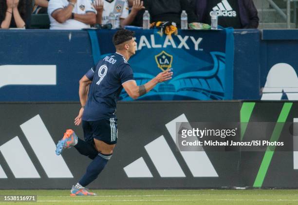 Alan Pulido of Sporting Kansas City scores a goal and celebrates during a game between Sporting Kansas City and Los Angeles Galaxy at Dignity Health...