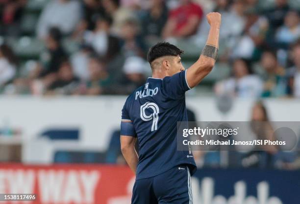 Alan Pulido of Sporting Kansas City scores a goal and celebrates during a game between Sporting Kansas City and Los Angeles Galaxy at Dignity Health...