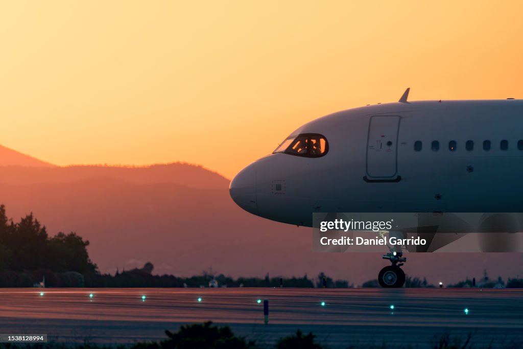 Side view of aircraft cabin on its way to the takeoff runway, close-up of aircraft cabin in the moments before takeoff