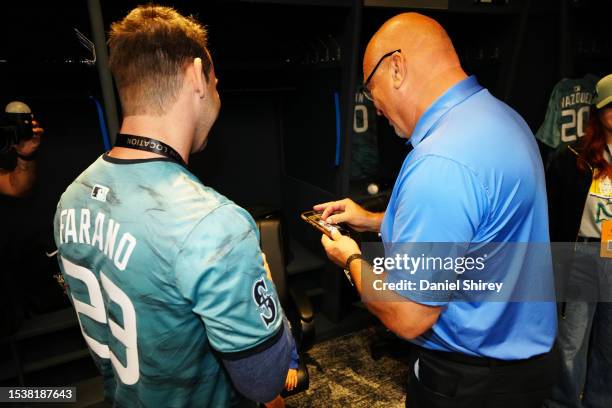 Cal Ripken Jr. Chats with a guest during the On-Location All-Star Experience at T-Mobile Park on Sunday, July 9, 2023 in Seattle, Washington.