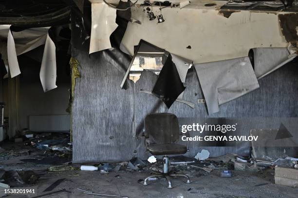 This photograph taken on July 17 shows a chair among rubble in a destroyed beauty salon in the town of Lyman, Donetsk region, amid the Russian...