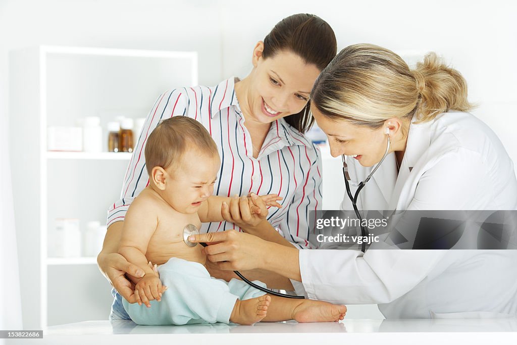 Pediatrician checking baby patient