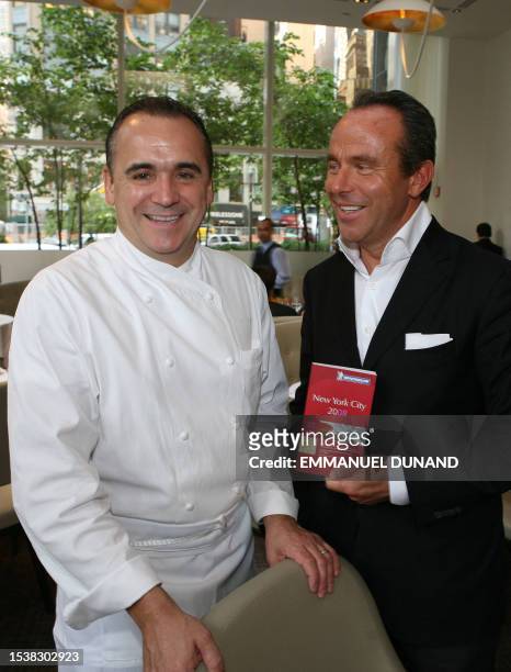 French chef Jean Georges Vongerichten and Michelin Guide Director Jean-Luc Naret pose at Vongerrichten's flagship Manhattan restaurant "Jean Georges"...