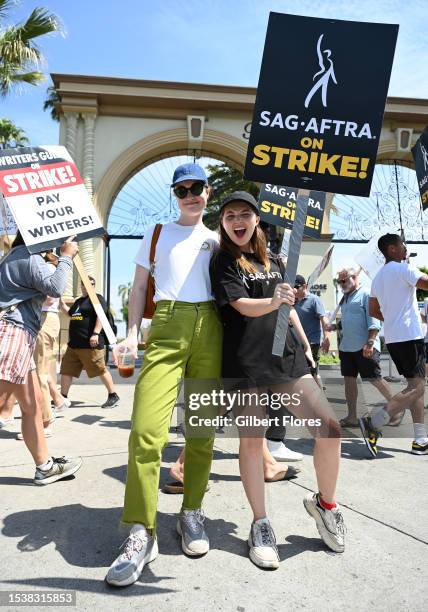 Liv Hewson and Samantha Hanratty walk the picket line on Day 5 in support of the SAG-AFTRA and WGA strike at Paramount Pictures Studio on July 17,...