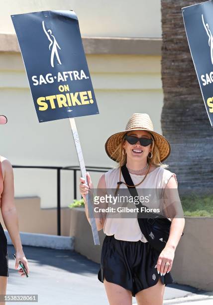 Hilary Duff walks the picket line on Day 5 in support of the SAG-AFTRA and WGA strike at Paramount Pictures Studio on July 17, 2023 in Los Angeles,...