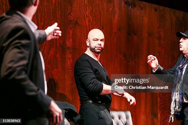 Robert Gallinowski , Guntbert Warns and Joerg Gudzuhn perform on stage during 'Ein Bisschen Ruhe Vor Dem Sturm' play at Renaissance Theater Berlin on...