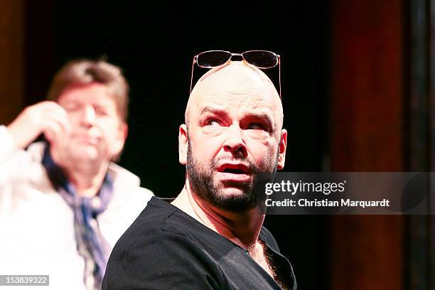 Robert Gallinowski and Joerg Gudzuhn perform on stage during 'Ein Bisschen Ruhe Vor Dem Sturm' play at Renaissance Theater Berlin on October 09, 2012...