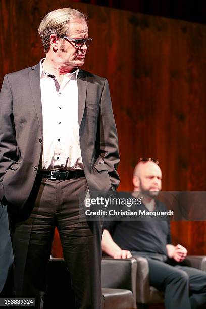 Robert Gallinowski and Guntbert Warns perform on stage during 'Ein Bisschen Ruhe Vor Dem Sturm' play at Renaissance Theater Berlin on October 09,...