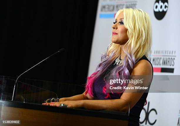 Singer Christina Aguilera speaks onstage during the 40th Anniversary American Music Awards nominations press conference at the JW Marriott Los...