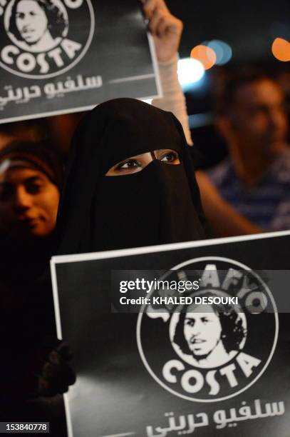 Fully veiled Egyptian Muslim woman from a group called "Salafyo Costa'' attends a march in front of state television building in Cairo in Cairo on...