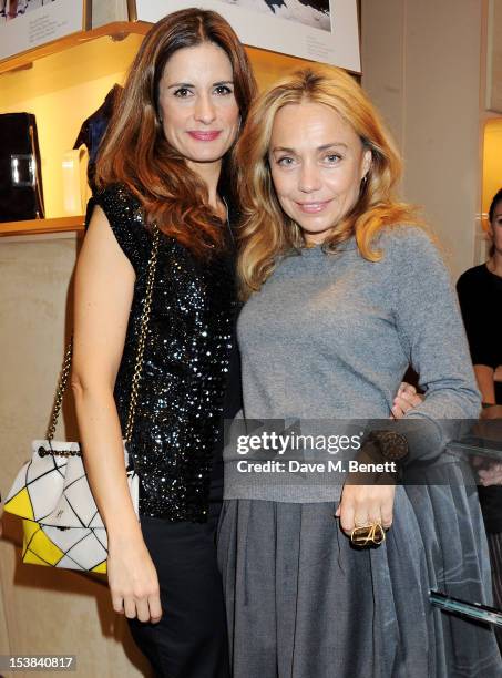 Livia Firth and Jeanne Marine attend the Roger Vivier Prismick A/W 2012 Exhibition at the Roger Vivier Flagship Boutique on October 9, 2012 in...