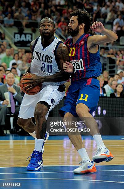 Dallas Mavericks' guard Dominique Jones vies with Regal Barcelona's guard Juan Carlos Navarro during the NBA friendly basketball match FC Barcelona...