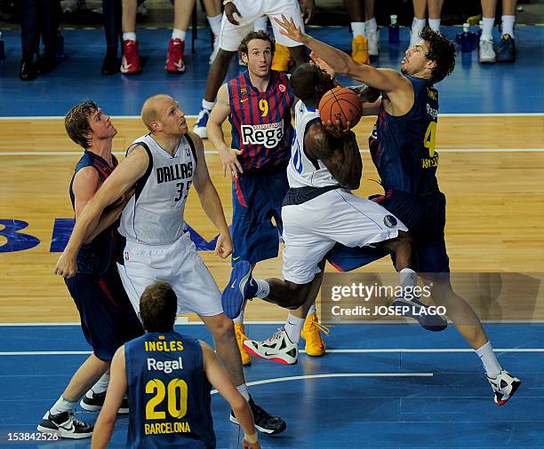 Regal Barcelona's players vies with Dallas Mavericks' during the NBA friendly basketball match FC Barcelona Regal vs Dallas Mavericks on October 9,...
