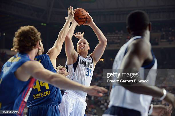 Chris Kaman of the Dallas Mavericks shoots against FC Barcelona Regal during NBA Europe Live 2012 on October 9, 2012 at Palau Sant Jordi in...