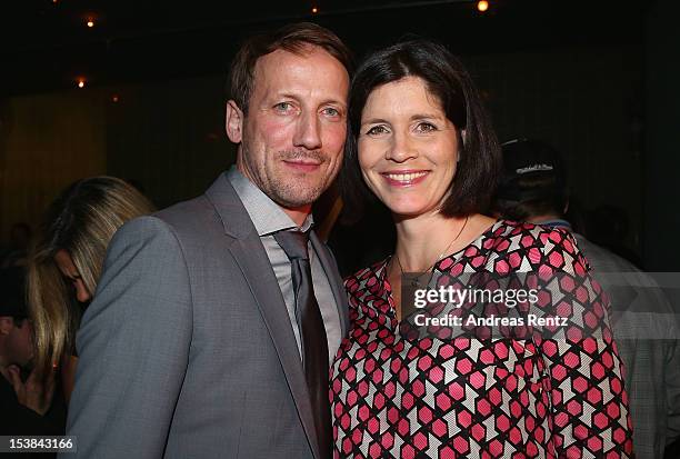 Wotan Wilke Moehring and partner Anna Theis attend the 'Mann Tut Was Mann Kann' Germany Premiere after show party on October 9, 2012 in Berlin,...