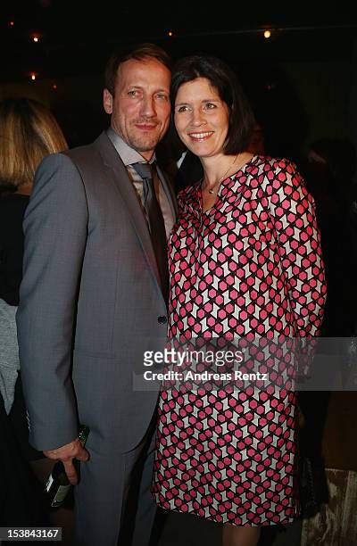 Wotan Wilke Moehring and partner Anna Theis attend the 'Mann Tut Was Mann Kann' Germany Premiere after show party on October 9, 2012 in Berlin,...