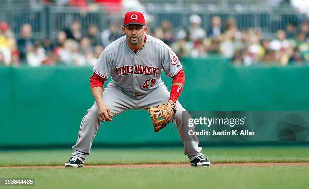 Miguel Cairo of the Cincinnati Reds plays the field against the Pittsburgh Pirates during the game on September 30, 2012 at PNC Park in Pittsburgh,...