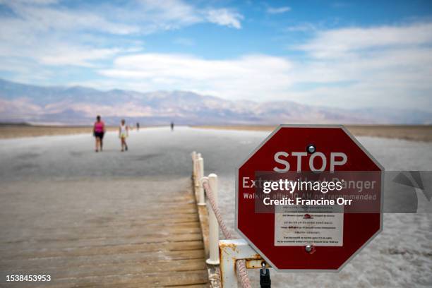 Death Valley, CA An extreme heat danger sign at Badwater Basin, Death Valley National Park, on Monday, July 17 in Death Valley, CA. The temperature...