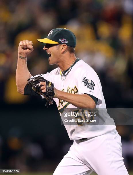 Grant Balfour of the Oakland Athletics celebrates after the last out of their game against the Detroit Tigers during Game Three of the American...