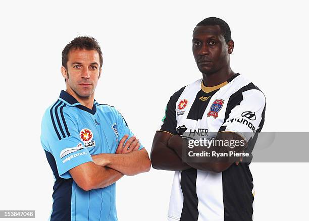 Alessandro Del Piero of Sydney FC and Emile Heskey of Newcastle Jets pose during a 2012/13 A-League player portrait session at Parramatta Stadium on...