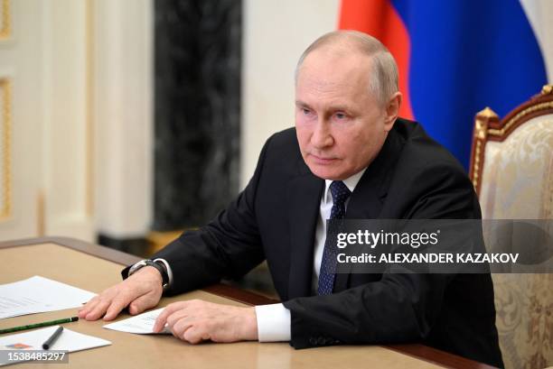 Russian President Vladimir Putin attends a meeting on Crimean Bridge attack via a video link at the Kremlin in Moscow on July 17, 2023. The Kremlin...