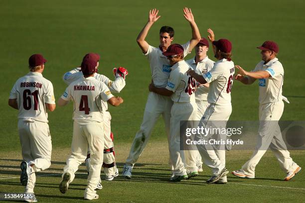 Ben Cutting of the Bulls celebrates with team mates after dismissing Cameron White of the Bushrangers during day one of the Sheffield Shield match...