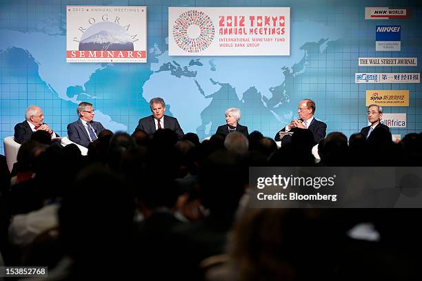 Martin Wolf, associate editor and chief economics commentator at the Financial Times, from left, Christian Noyer, governor of the Bank of France,...