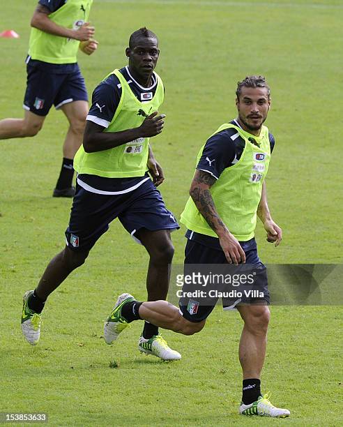Pablo Daniel Osvaldo and Mario Balotelli of Italy during a training session ahead of their FIFA World Cup qualifier against Armenia at Coverciano on...