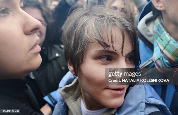 One of the members of the all-girl punk band "Pussy Riot," Yekaterina Samutsevich , looks on as she stands outside a court in Moscow, on October 10...