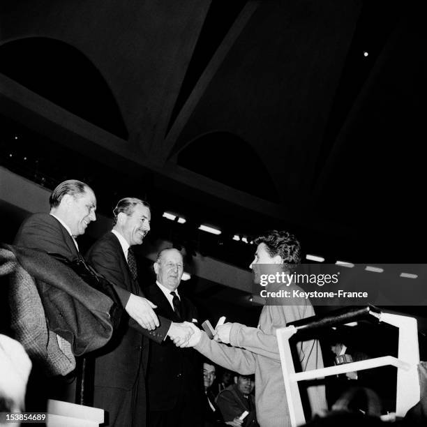 Runner Michel Jazy With Secretary Of State Of Sports And Youth Maurice Herzog After His Victory In The 1000 Meters Race At France Germany Indoor...