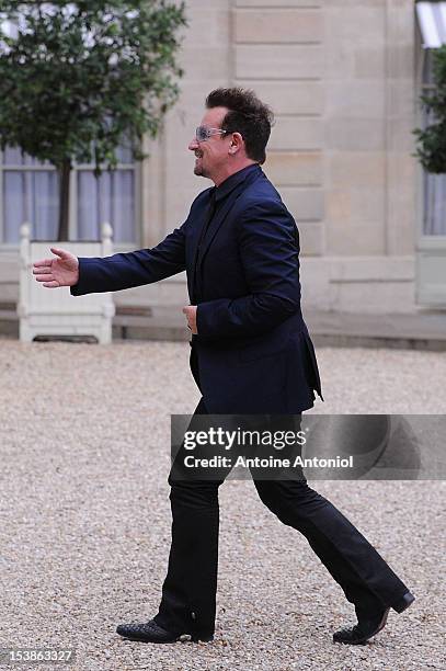 Frontman Bono, arrives for a meeting with French President Francois Hollande at the Elysee Palace on October 10, 2012 in Paris, France.