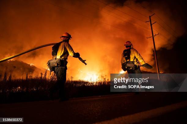CalFire firefighters in action. CalFire firefighters take on the Rabbit Fire that is currently taking over Moreno Valley, California. Officials have...