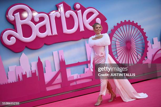 Australian actress Margot Robbie poses on the pink carpet upon arrival for the European premiere of "Barbie" in central London on July 12, 2023....