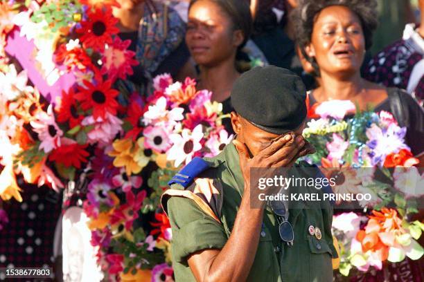 Democratic Republic of Congo soldier cries as the body of slain President Laurent Kabila arrives at the People's Palace in Kingshasa 21 January 2001...