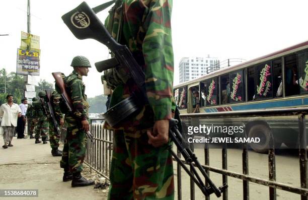 Army troops keep vigil at one of the main road of Dhaka, 26 September 2001, ahead of the country's October 01 general elections. Some 55,000 army...