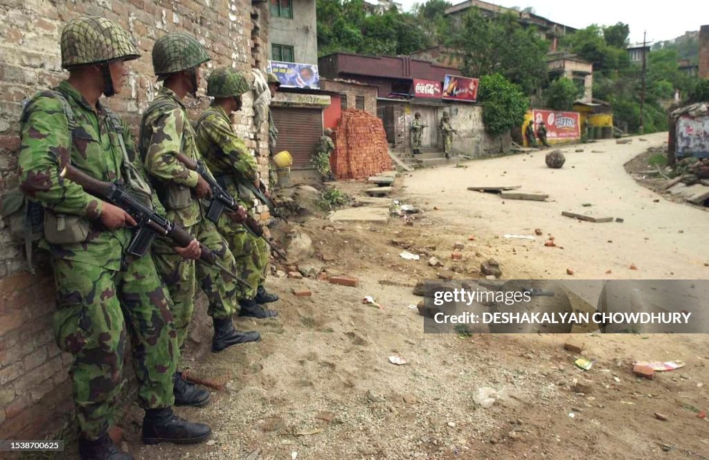 Nepalese soldiers keep watch on a street in Kathmandu after a pitched