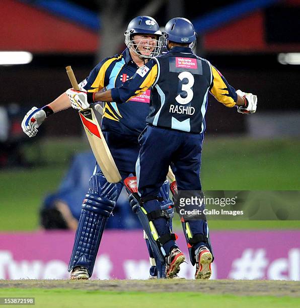 Gary Ballance and Adil Rashid of Yorkshire celebrate the win during the Karbonn Smart CLT20 pre-tournament Qualifying Stage match between Yorkshire...