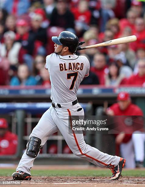 Gregor Blanco of the San Francisco Giants hits a two-run home run in the second inning against the Cincinnati Reds in Game Four of the National...