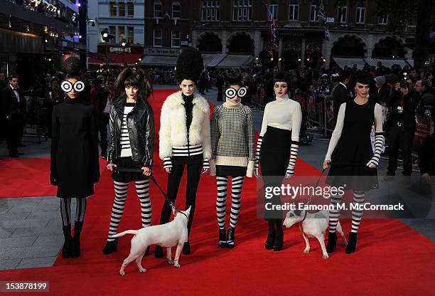 Models pose on the red carpet during the Premiere of "Frankenweenie" at the opening of the BFI London Film Festival at Odeon Leicester Square on...