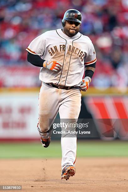 Pablo Sandoval of the San Francisco Giants rounds the bases after hitting a two-run home run in the seventh inning against the Cincinnati Reds in...