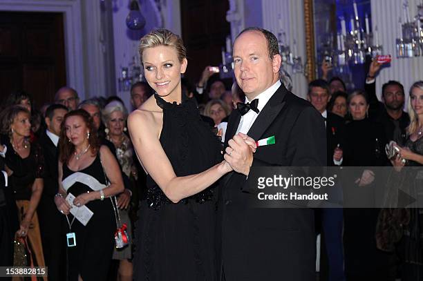In this handout image provided by Ufficio Stampa Ballo del Giglio, Prince Albert of Monaco and princess Charlene of Monaco attend the 2012 Ballo del...